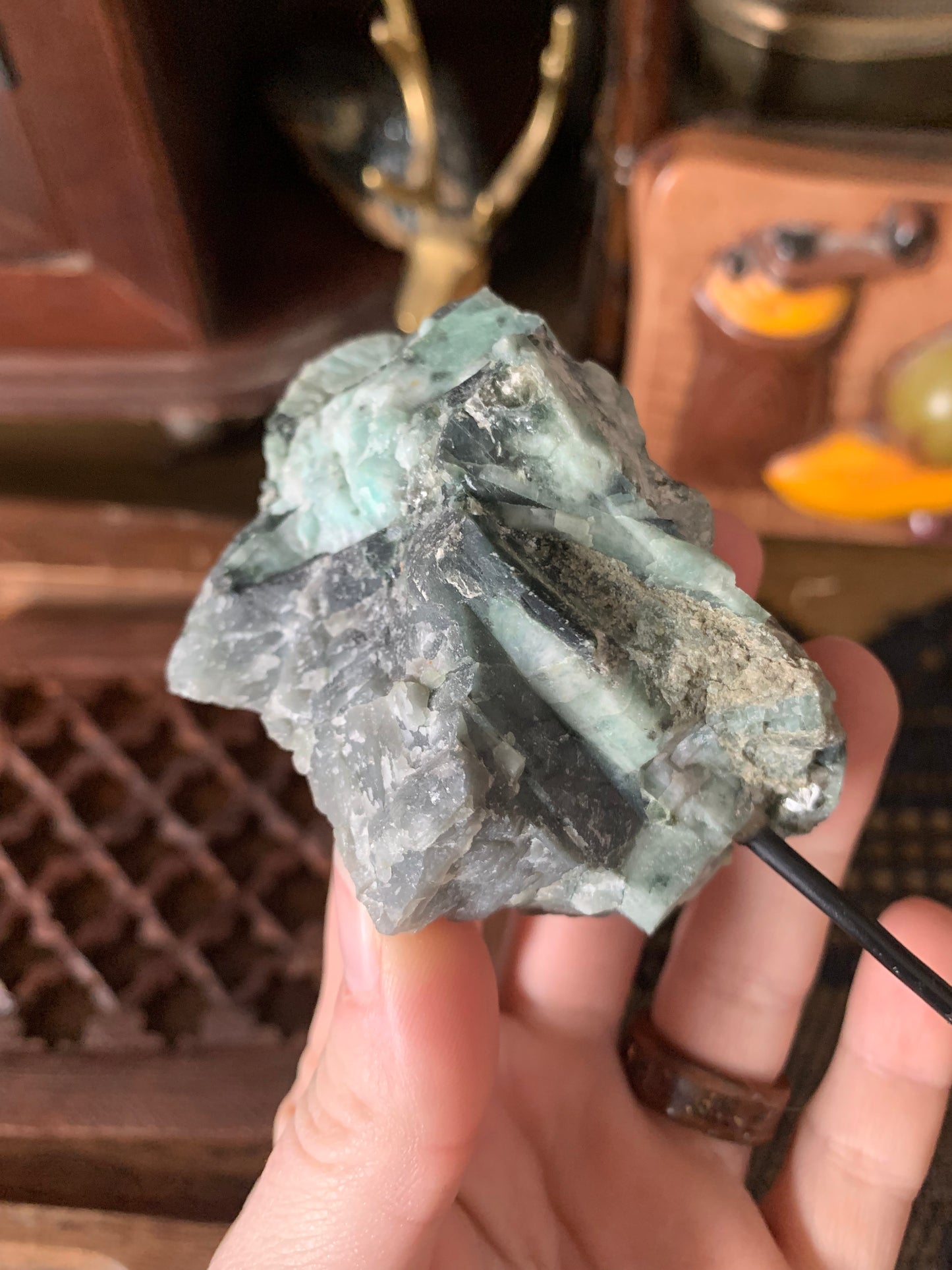 raw emerald on stand