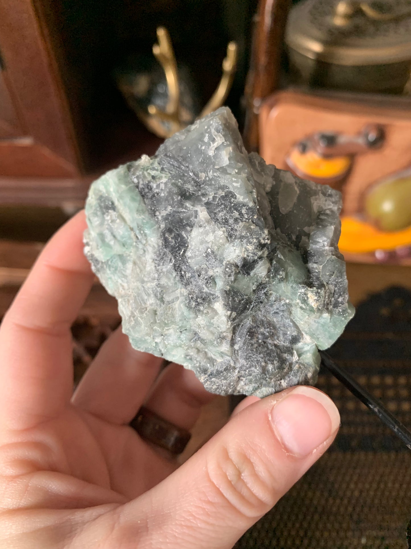 raw emerald on stand